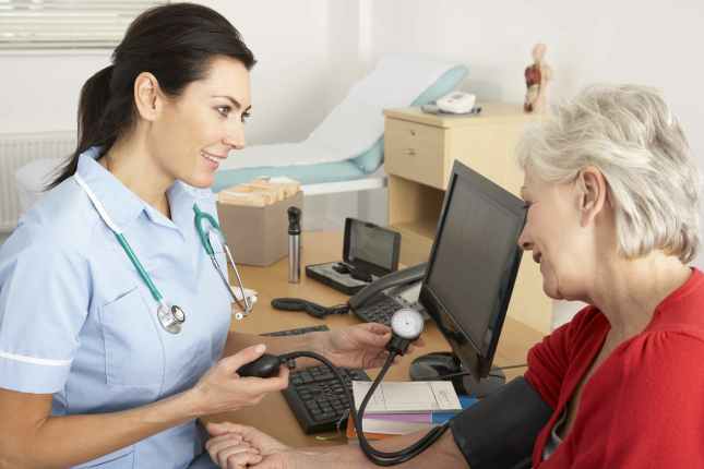 nurse taking blood pressure